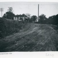 Automobile In Front of a House